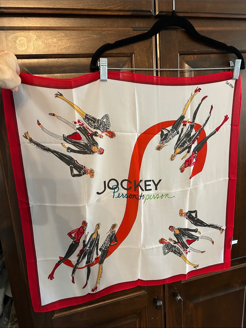 Jockey 2012 “Person to Person” Cream Scarf with Red and Border 24” x 24”